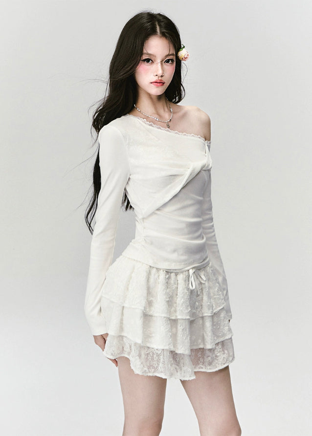 Fragileheart off-shoulder top, white lace blouse, asymmetric draped shirt, luxury Korean fashion, elegant feminine outfit, quiet luxury style, pastel noir aesthetic, winter 2025 collection, modern romantic fashion, ivory one-shoulder knit, soft lace trim top, minimalist luxury wear, Korean chic fashion, delicate off-shoulder blouse
