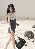 Sleeveless gray top with ivory lace detail