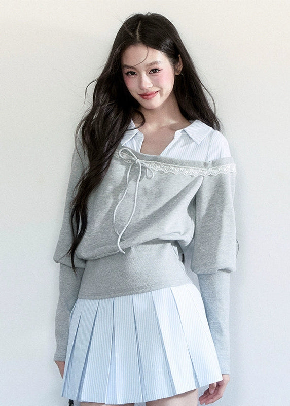 Fragileheart layered set, blue striped pleated skirt, luxury Korean fashion, preppy K-fashion outfit, faux two-piece knit top, quiet luxury womenswear, pastel noir aesthetic, elegant school style, 2025 autumn collection, modern feminine outfit, soft grey sweatshirt set, chic Korean look, academic romantic fashion, delicate layered design
