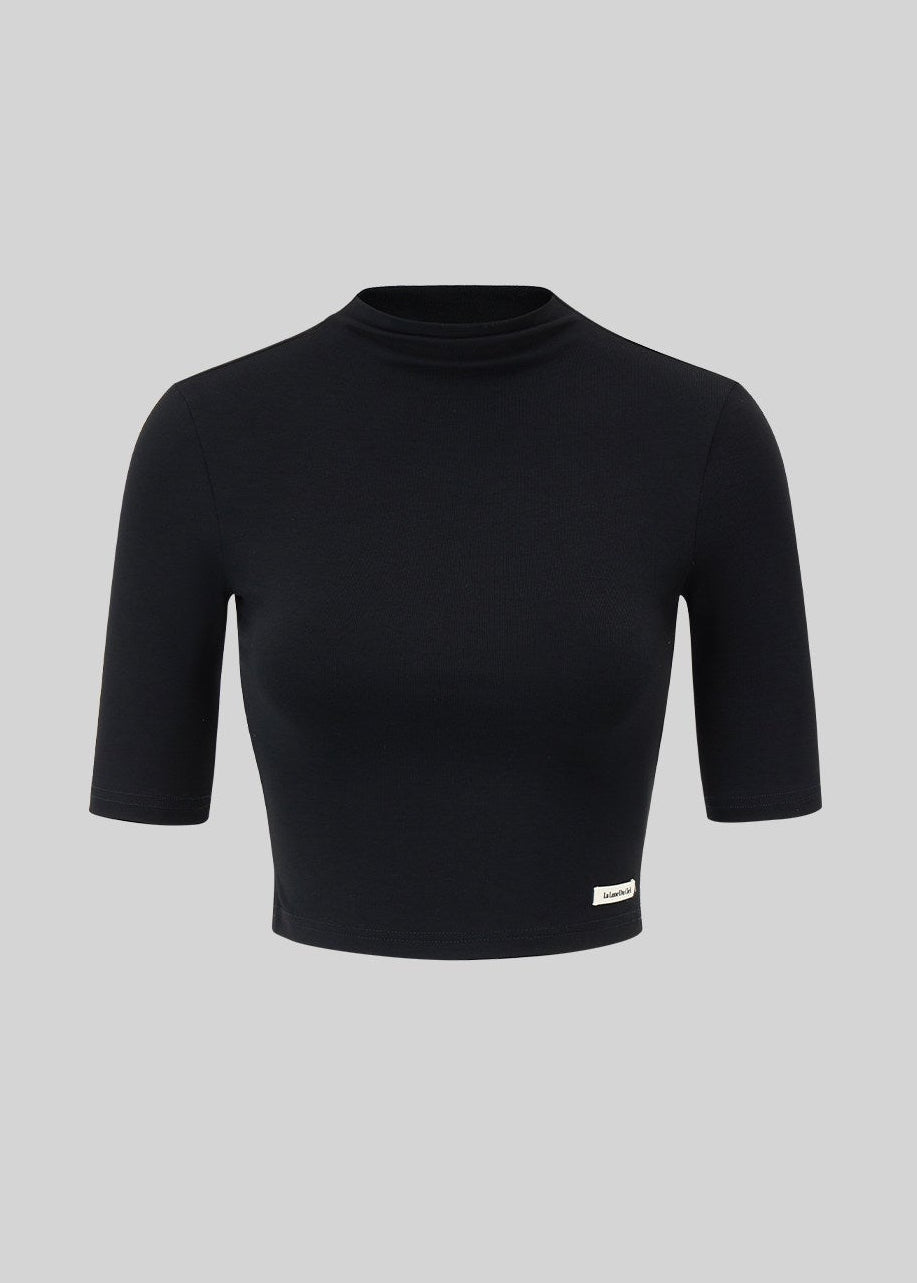 Women’s black cropped mock-neck top and mini skirt matching set