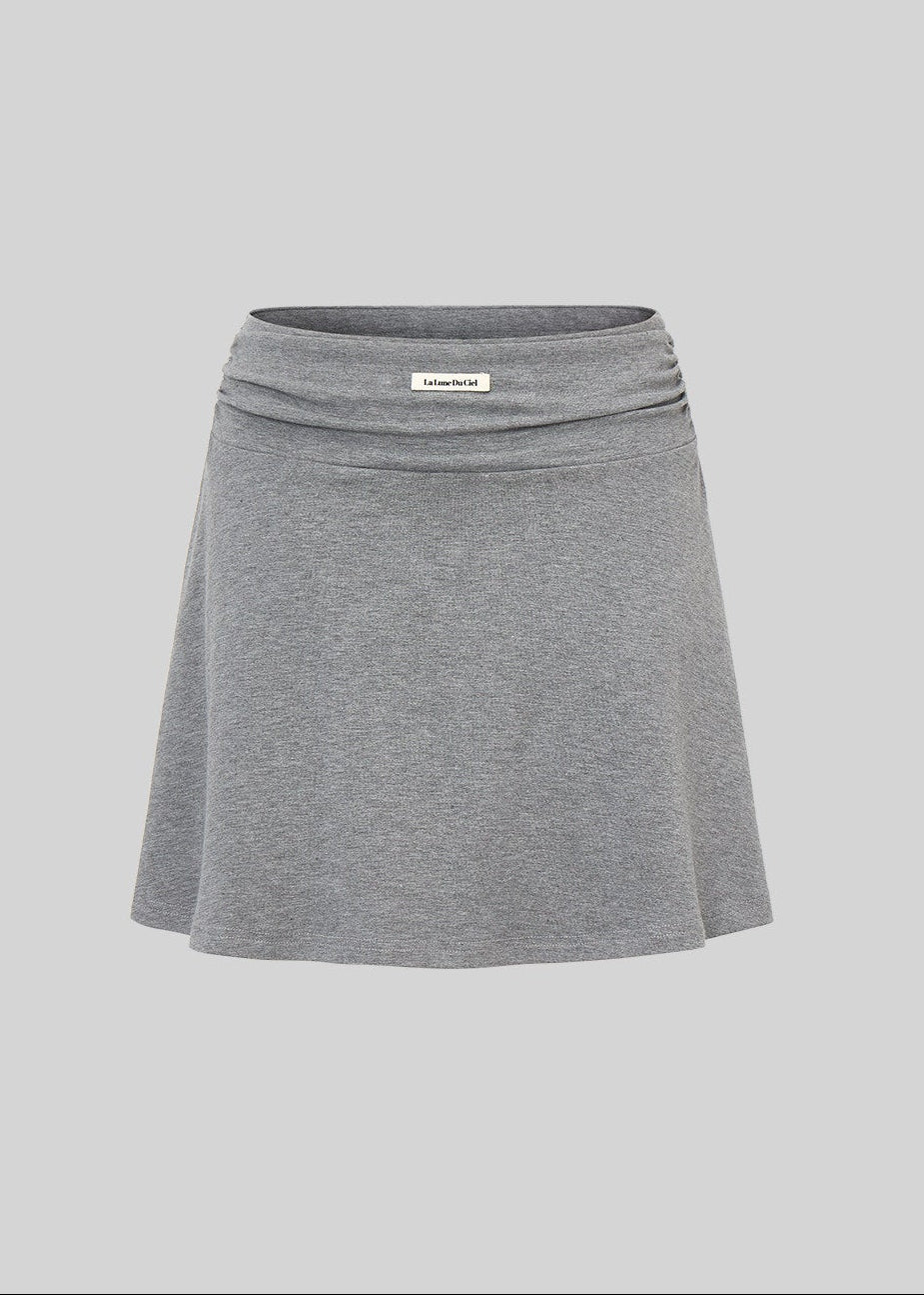 Faux two-piece long-sleeve top with contrast neckline and gray mini skirt