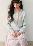 pastel cardigan, heart embroidery knit, contrast trim sweater, Korean girly fashion, AW soft knitwear, umoumo aesthetic cardigan, sweet colored yarn knit, pastel blue cardigan, cute heart badge knit, feminine Korean outfit, loose cozy knit jacket, pink button cardigan, soft winter knit, Fragileheart aesthetic, girly pastel style, cute short cardigan, warm autumn winter knit top, Korean cute girl sweater