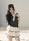 Gray fitted short-sleeve top with ivory lace bow neckline