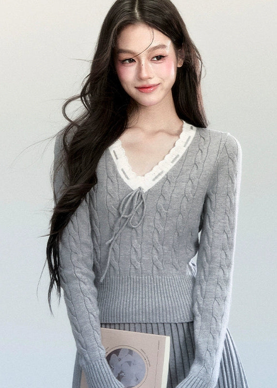 Fragileheart knit skirt set, lace V-neck sweater, pleated mini skirt outfit, luxury Korean fashion, quiet luxury womenswear, pastel noir aesthetic, elegant pre-autumn outfit, grey two-piece knit set, romantic feminine fashion, K-fashion 2025, vintage-inspired knitwear, soft Korean fashion, delicate pleated skirt look, refined knit coordination
