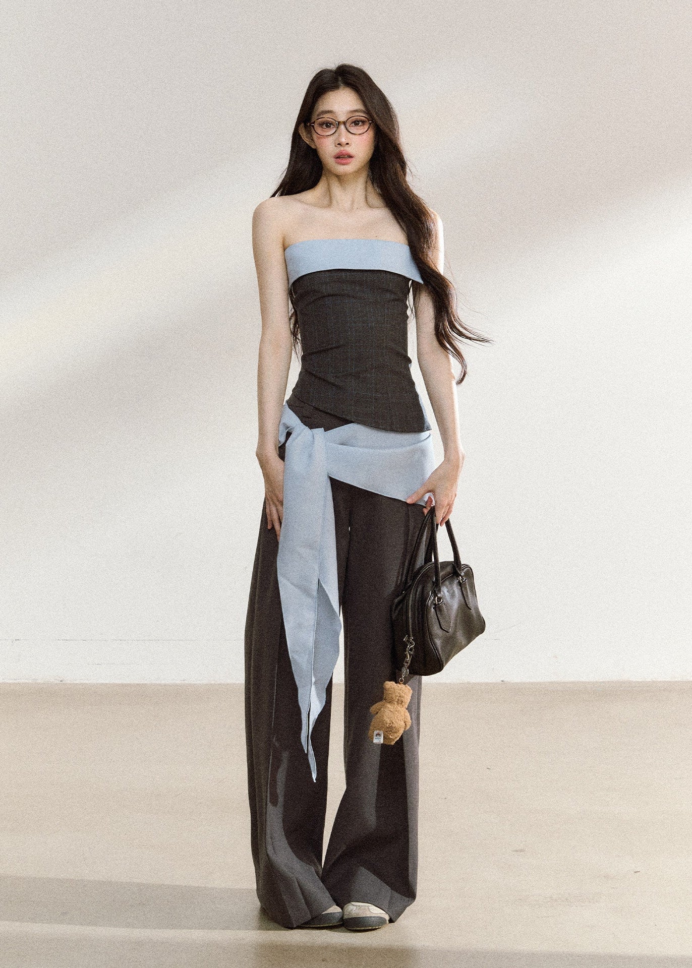Dark gray relaxed wide-leg trousers with a tailored waistband