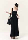 Black cross-print knit maxi dress with cropped pinstriped shrug