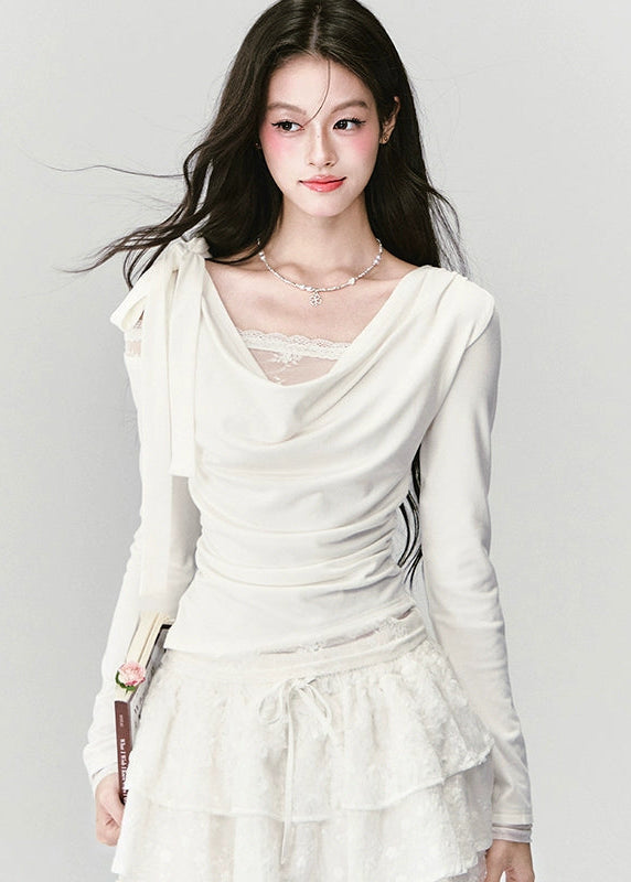 Soft as a dream, elegant as silence — the Cream Reverie Lace Top captures Fragileheart’s signature “pastel meets noir” allure. The cowl neckline and lace underlayer reveal a graceful décolleté, while the sculpted waist flatters the silhouette with effortless poise. Perfect for autumn and winter ensembles that balance luxury and intimacy.