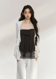 White draped cardigan with a charcoal gathered camisole