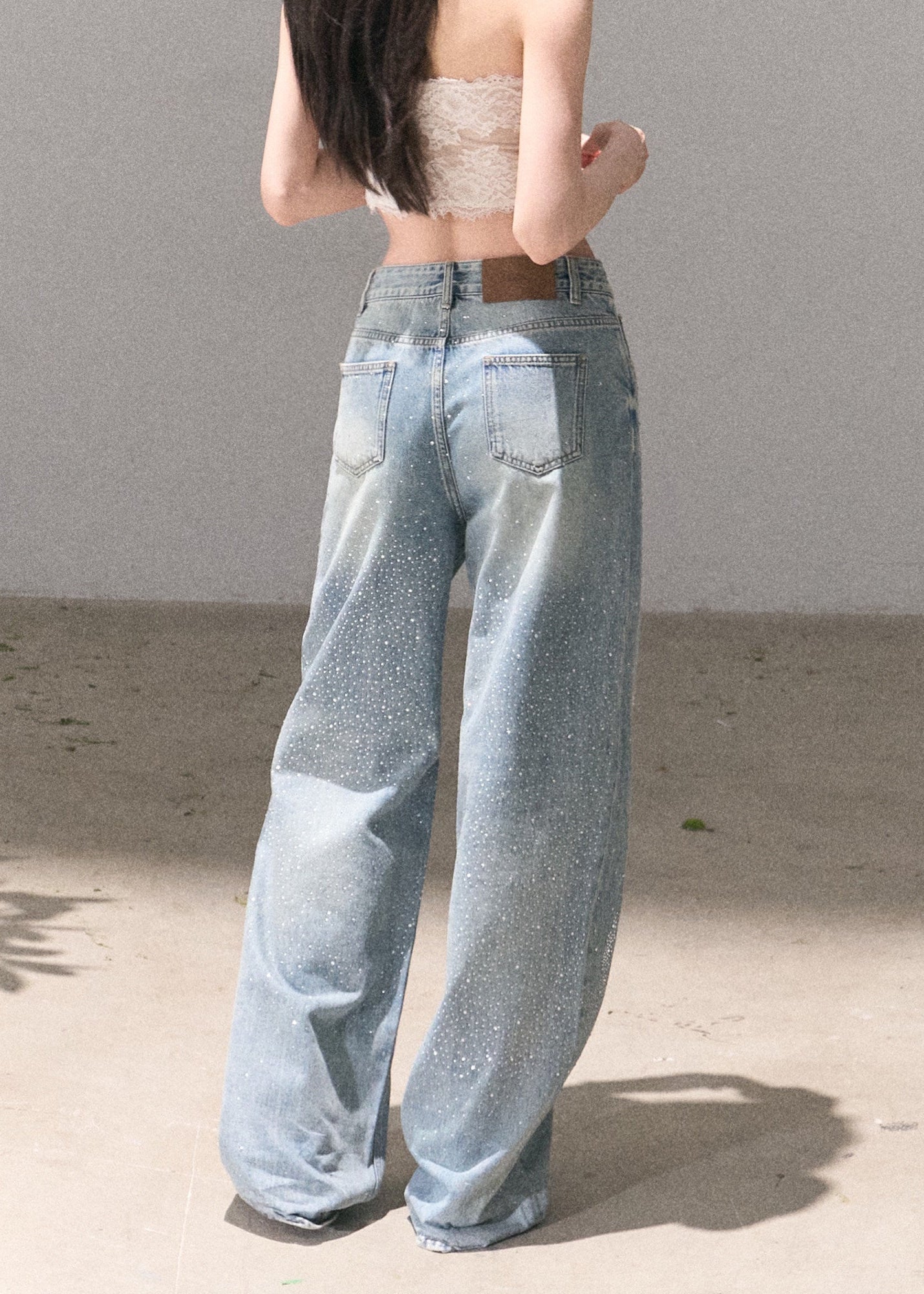 Distressed straight-leg denim pants with starry sparkle