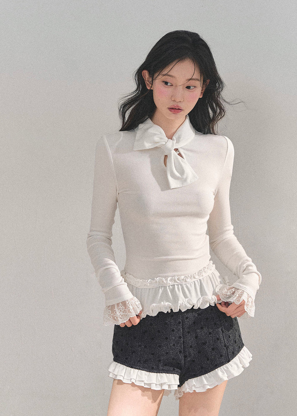 AOMALM top, Korean style knit top, fungus ruffle hem, bow lace T-shirt, winter feminine top, lace cuff long sleeve, soft knit blouse, aesthetic Korean fashion, winter layering top, slim fit tee women, elegant knitwear, ruffle lace shirt, cute winter tops, Korean girl outfit, soft girl aesthetic top, feminine long sleeve tee, winter fashion 2025, trending Korean tops, lace trim sweater top, chic bow neck shirt, romantic knit top.