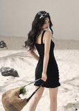 Black halter cutout knit mini dress with fitted silhouette and front button details