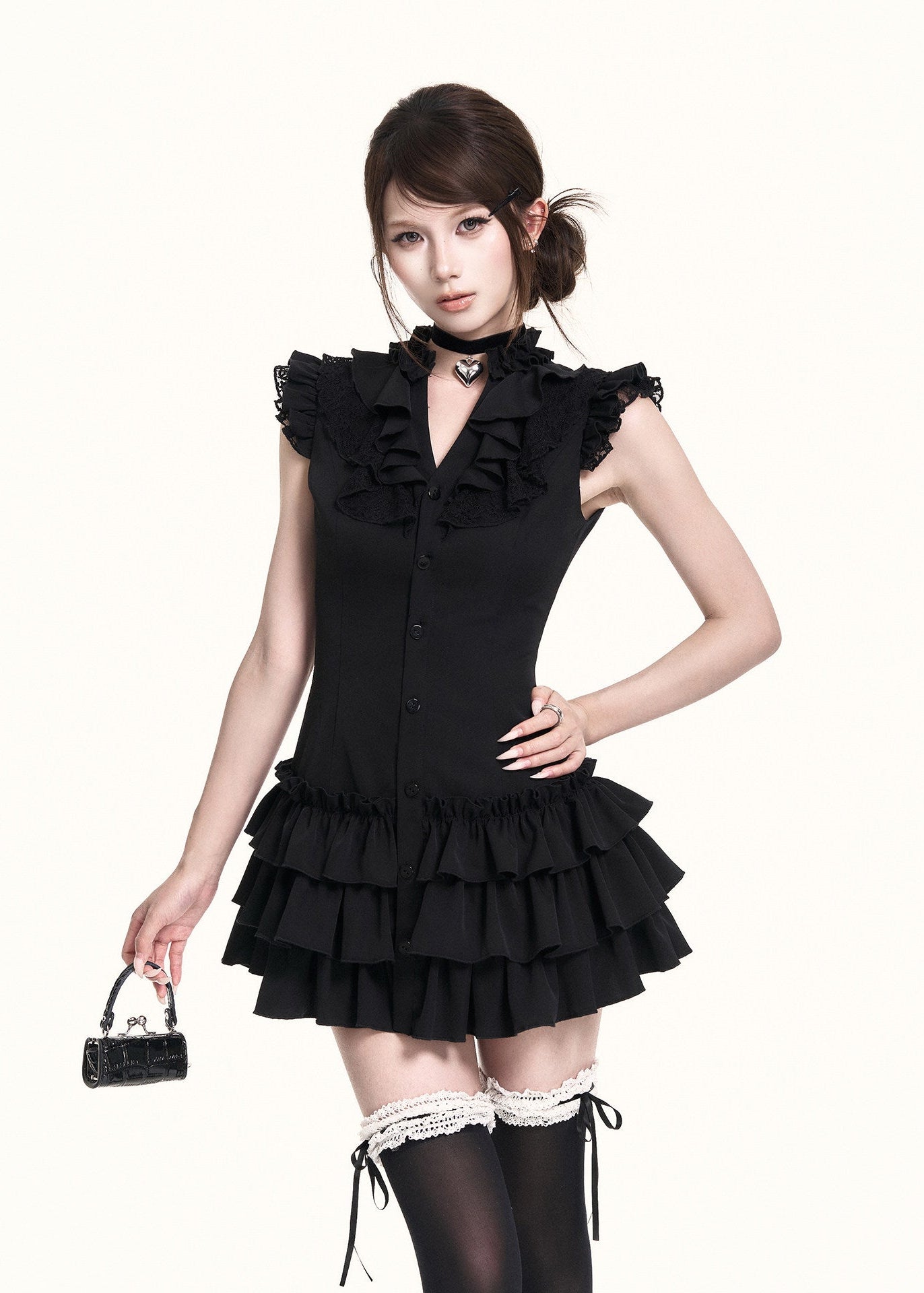 Fitted black dress with frilled neckline and button front