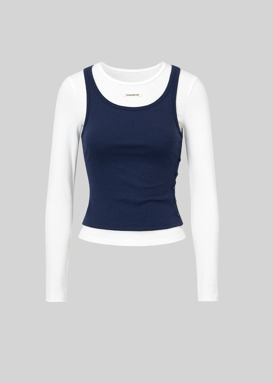 Model wearing a navy and white faux-layered top with a drawstring mini skirt