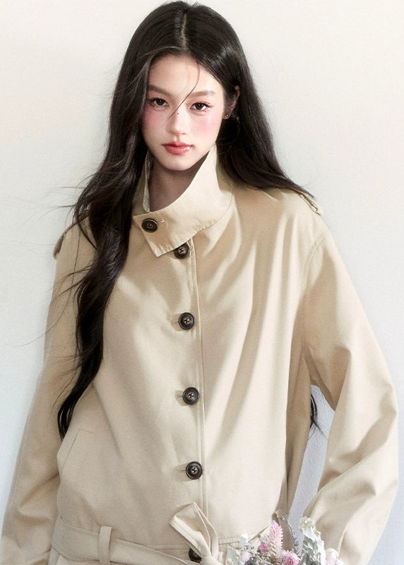 Fragileheart trench coat, short belted coat, luxury Korean fashion, beige autumn jacket, quiet luxury outerwear, pastel noir aesthetic, early fall outfit, elegant short trench, K-fashion 2025, minimalist feminine coat, tie-up waist jacket, sophisticated Korean fashion, modern beige outerwear, chic autumn coat
