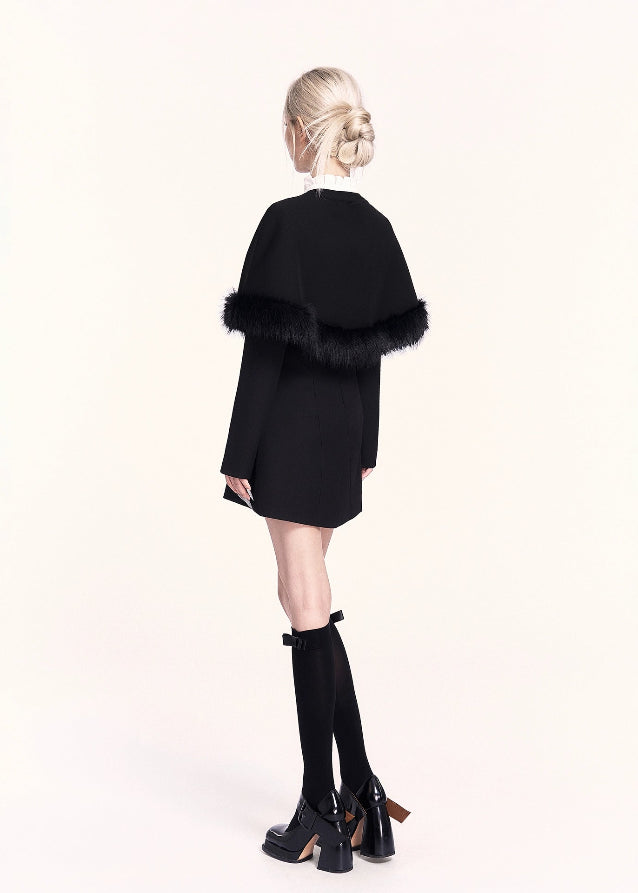 A refined Korean-style holiday dress set featuring a lace-trimmed bow collar mini dress paired with a luxurious woolen cape. The silhouette is soft yet slimming, blending sweet elegance with VOCK’s signature modern edge. Perfect for winter dates, parties, and seasonal photos.