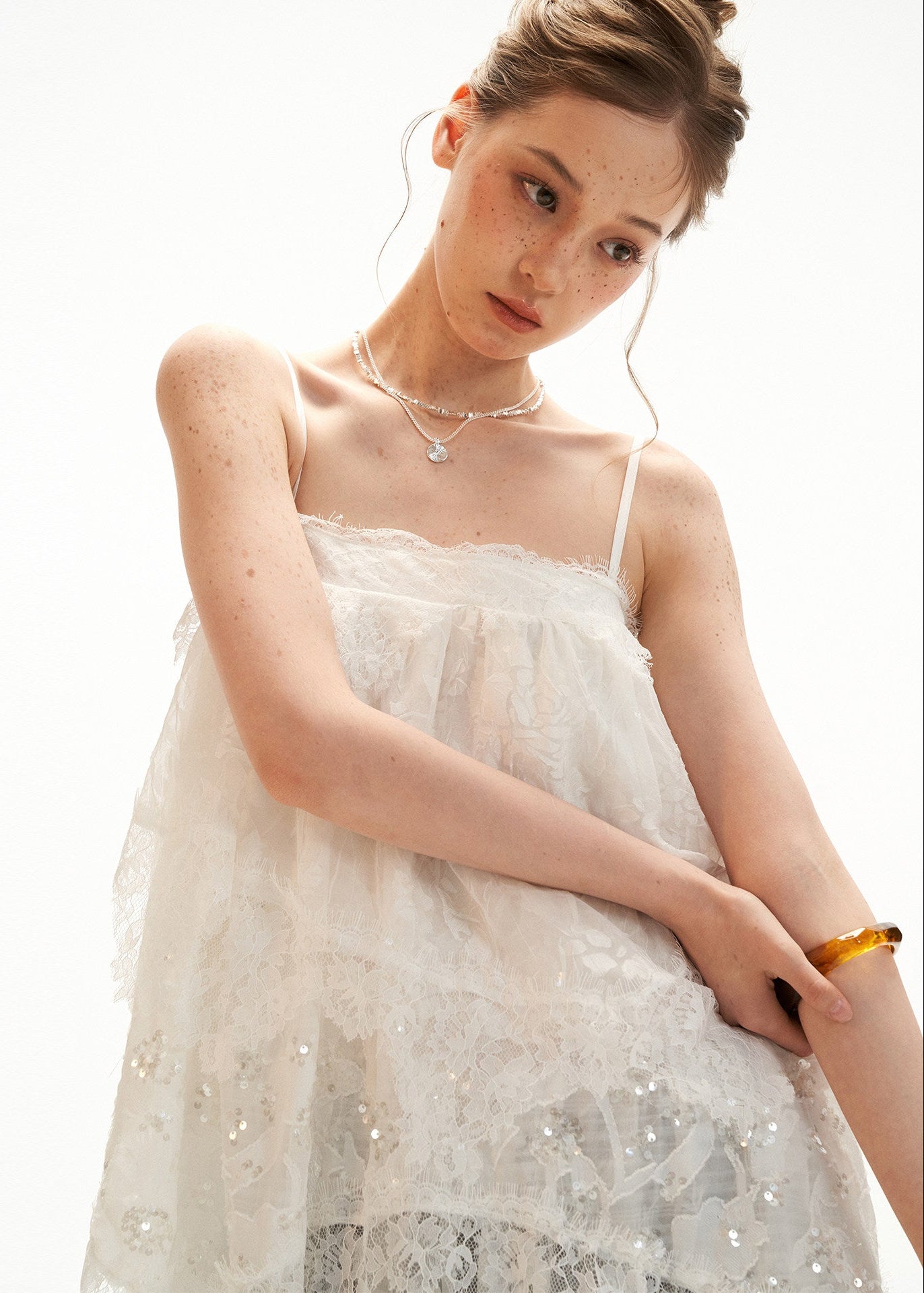 White fairy-style cami dress with irregular lace hem