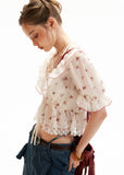 Romantic sheer summer top with lace-trim hem