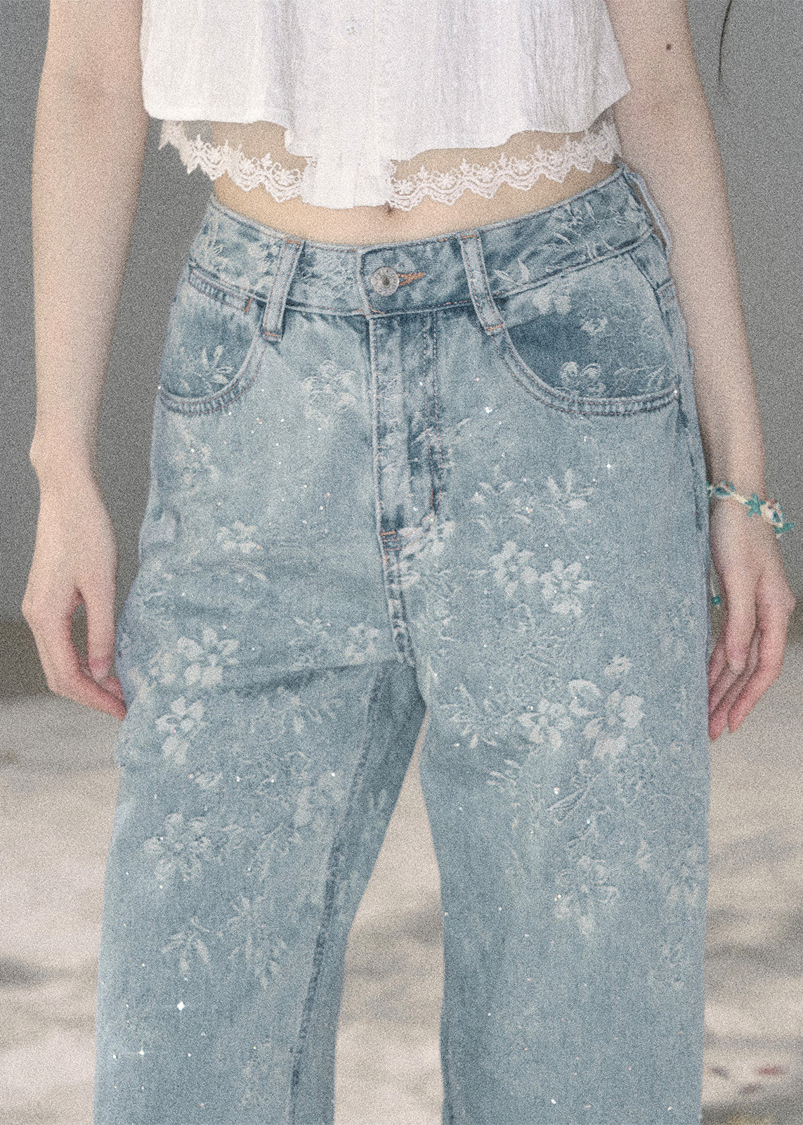 Light blue floral wide-leg jeans with sparkling embellishments