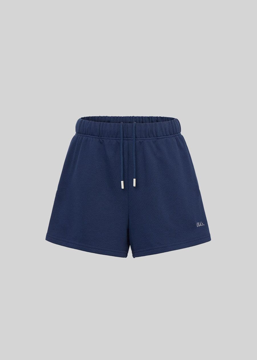 Relaxed navy sweatsuit with embroidered chest detail and drawstring waist