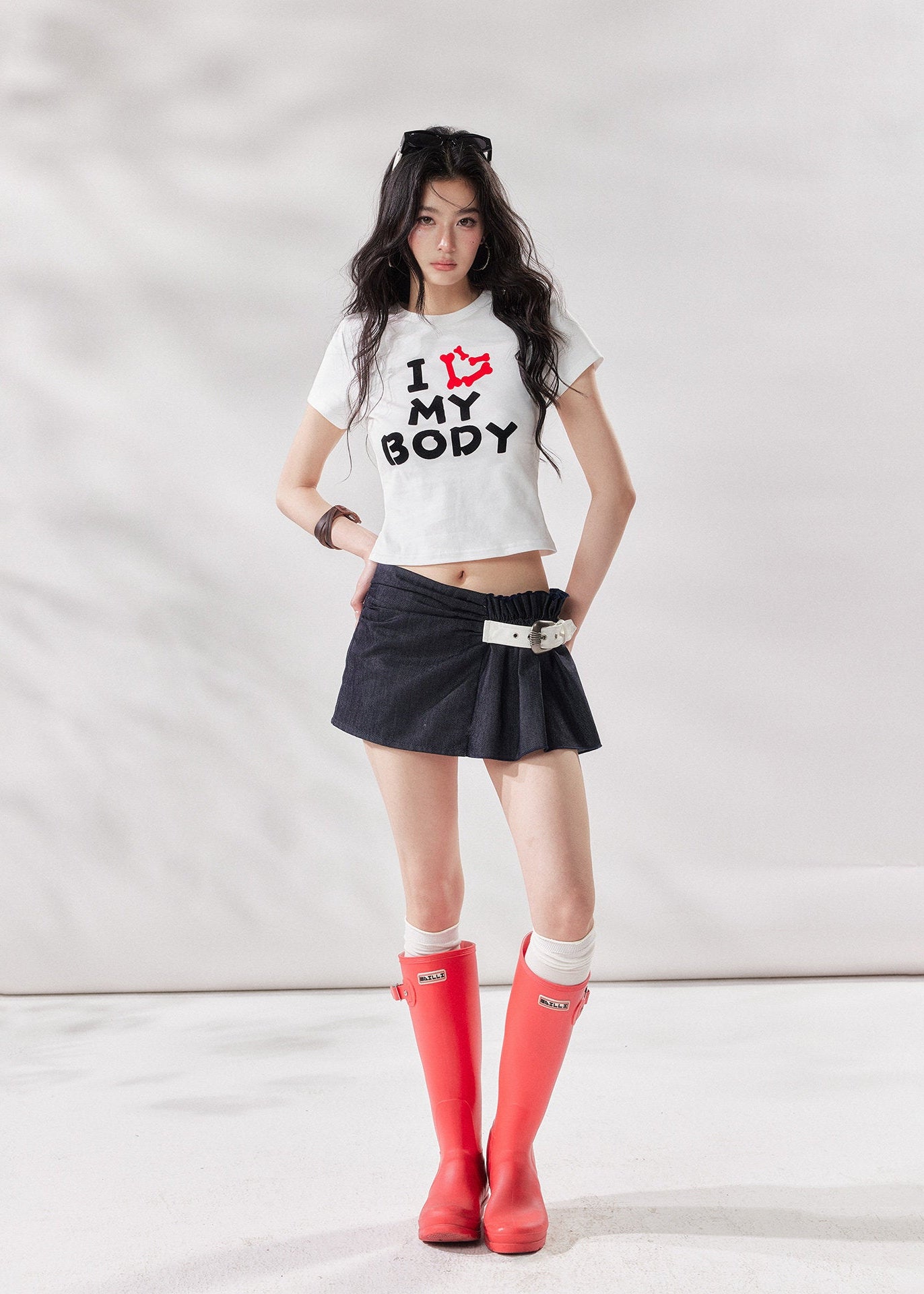 high waist mini skirt, belted mini skirt women, shirred waist skirt, irregular a line skirt, white mini skirt, black mini skirt, american style skirt, summer skirt women, korean fashion skirt, stylish casual skirt, trendy summer outfit, city style outfit women