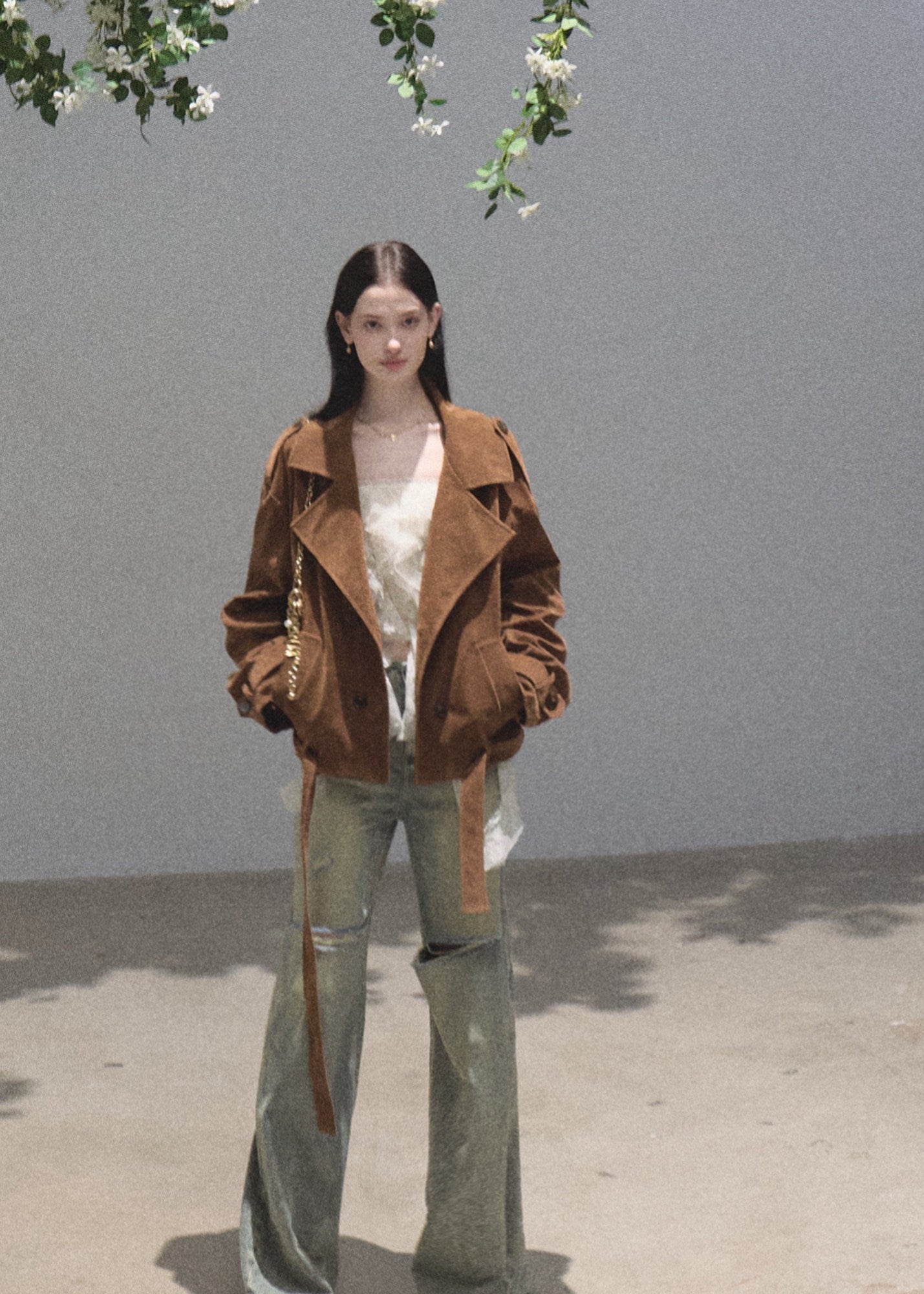 Faded green wide-leg jeans with distressed knee openings