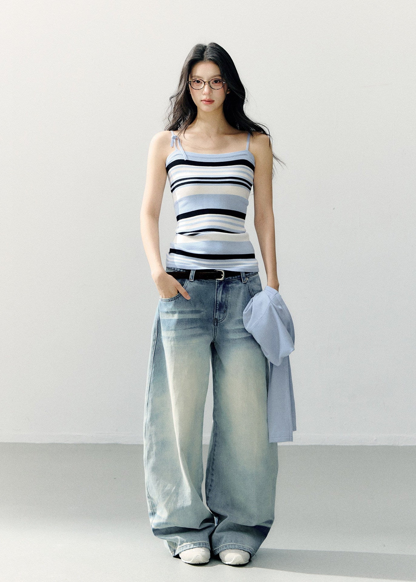 Pale blue cropped bolero with a navy and white striped camisole
