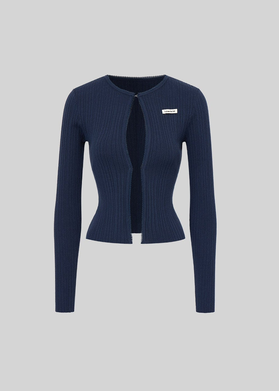 Fitted black knit cardigan and camisole styled with a matching mini skirt