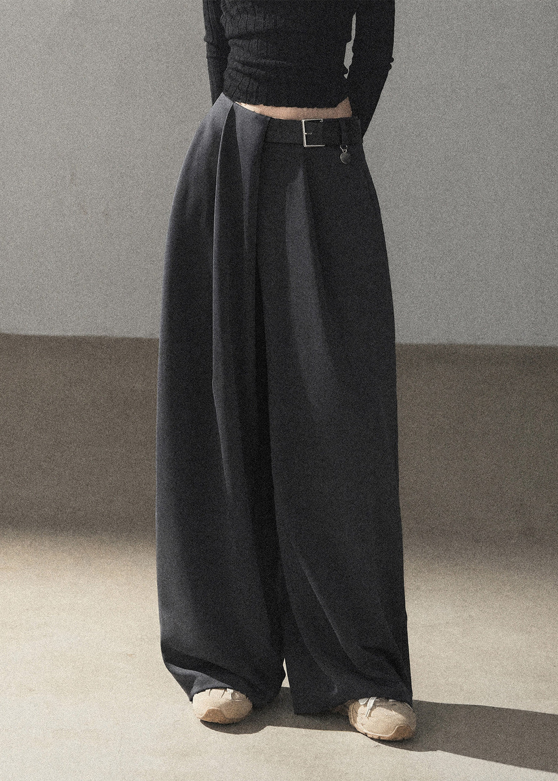 Model wearing taupe loose wide-leg pants