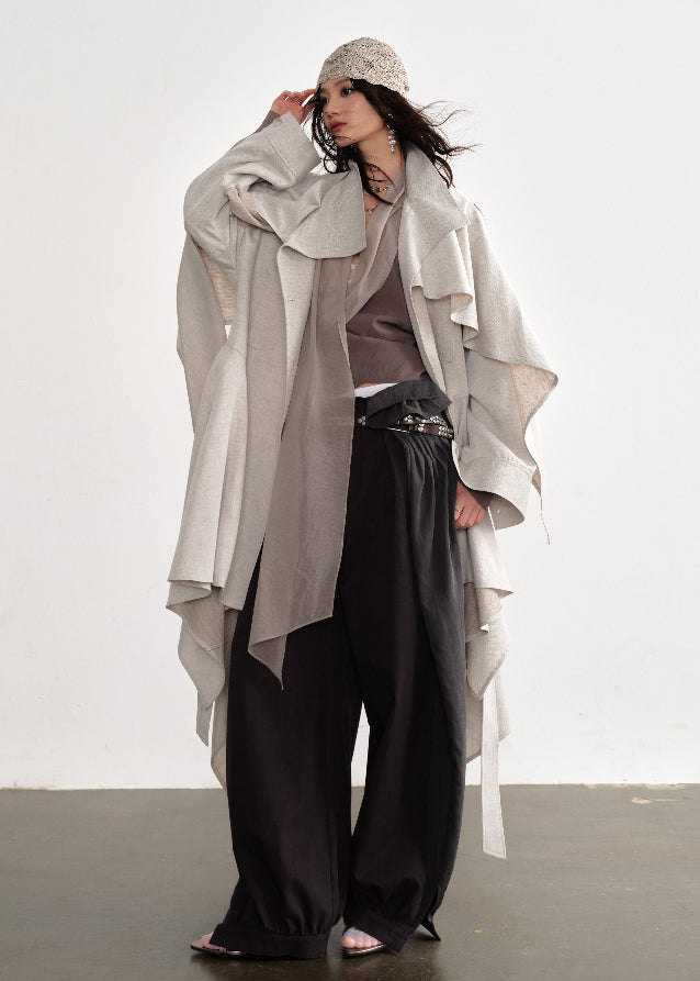 JNYLON detachable cape trench coat women, Korean stylish linen trench coat, modern Korean fashion long coat, chic natural style outerwear women, trendy Korean street chic trench, plaster white irregular trench coat, oversized linen blend coat Korean style, urban fashion layered trench women, stylish Korean aesthetic long coat, fashionable natural tone trench coat