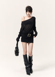 Front view of a fitted black mini dress with a sheer neckline and wide waist belt