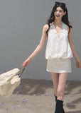 White open-back halter dress crafted from a lyocell-linen blend