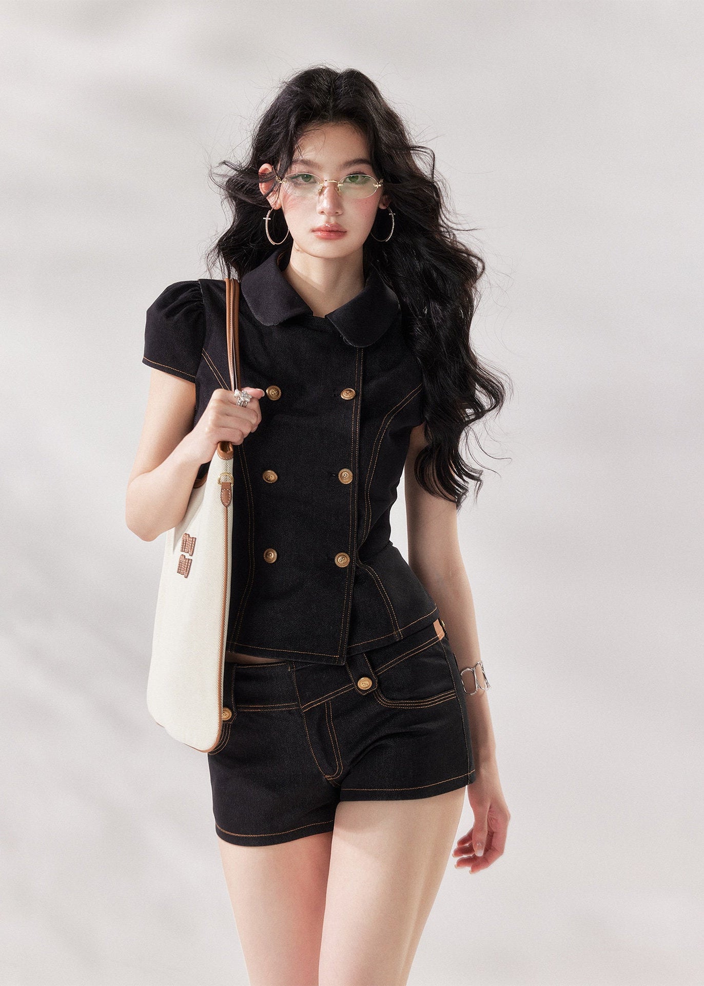 black denim set women, denim two piece set, structured denim outfit, double breasted top women, summer co ord set women, black short set outfit, modern minimalist outfit women, tailored denim set, chic summer outfit women, city style outfit women, fashion forward set women, clean line outfit women, edgy minimal fashion, elevated casual outfit, trendy denim set women