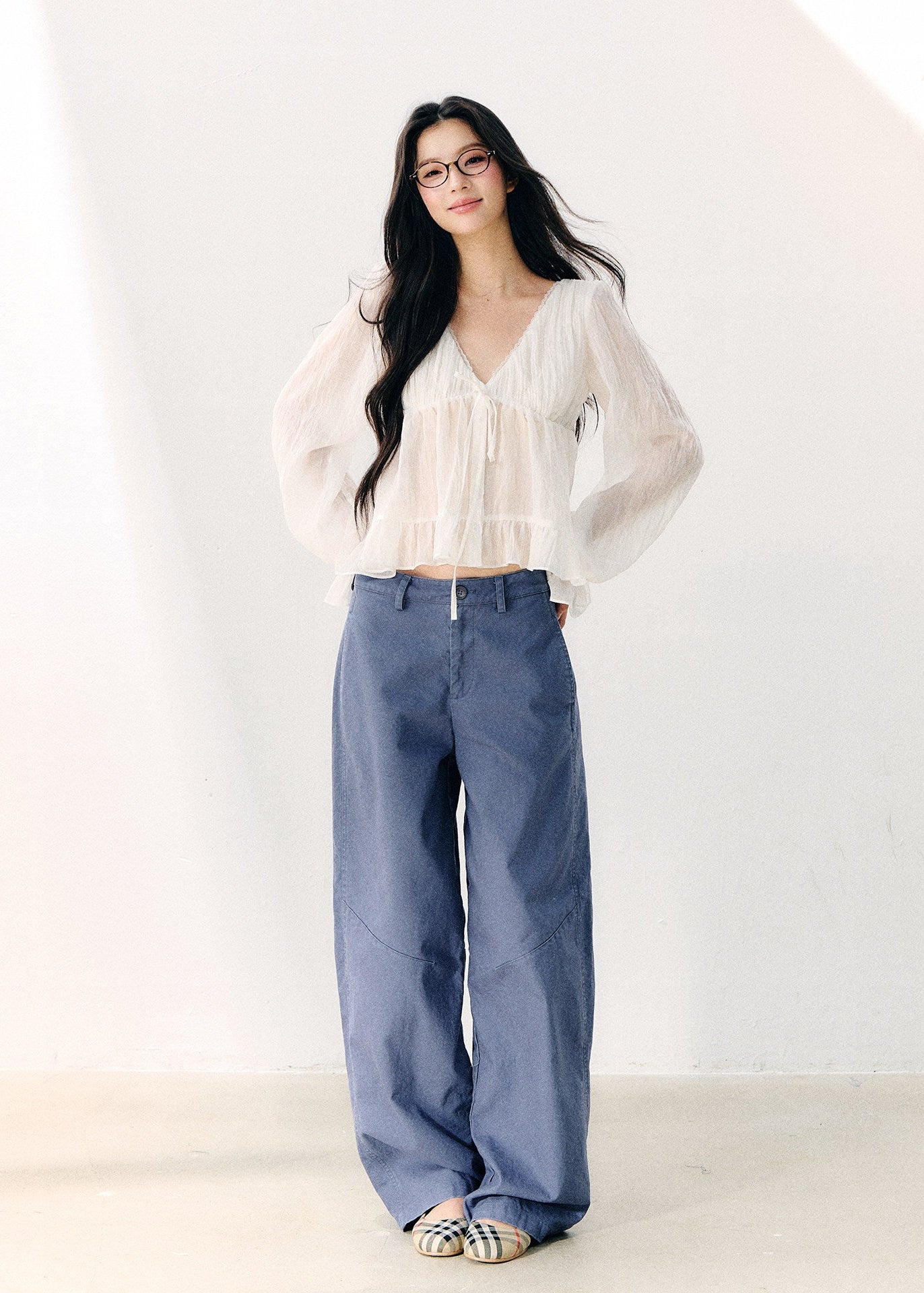 Washed blue straight-leg cotton trousers with a relaxed fit