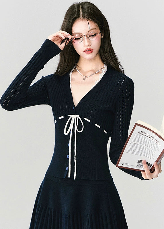 Fragileheart knit skirt set, black pleated two-piece, luxury Korean fashion, elegant autumn outfit, quiet luxury womenswear, pastel noir aesthetic, V-neck cardigan set, modern feminine K-fashion, minimalist ribbed knit, poetic fashion 2025, romantic fall outfit, delicate Korean style, sophisticated knitwear set, graceful pleated skirt look
