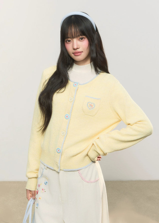 pastel cardigan, heart embroidery knit, contrast trim sweater, Korean girly fashion, AW soft knitwear, umoumo aesthetic cardigan, sweet colored yarn knit, pastel blue cardigan, cute heart badge knit, feminine Korean outfit, loose cozy knit jacket, pink button cardigan, soft winter knit, Fragileheart aesthetic, girly pastel style, cute short cardigan, warm autumn winter knit top, Korean cute girl sweater