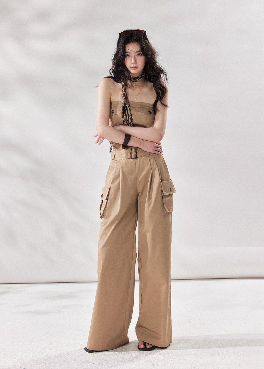 cargo jumpsuit women, strapless jumpsuit women, bandeau jumpsuit, utility jumpsuit women, wide leg jumpsuit women, summer jumpsuit outfit women, beige jumpsuit women, modern minimal outfit women, street style jumpsuit women, fashion forward jumpsuit, elevated casual outfit women, one piece outfit women, trendy cargo outfit women, chic summer jumpsuit, stylish utility outfit