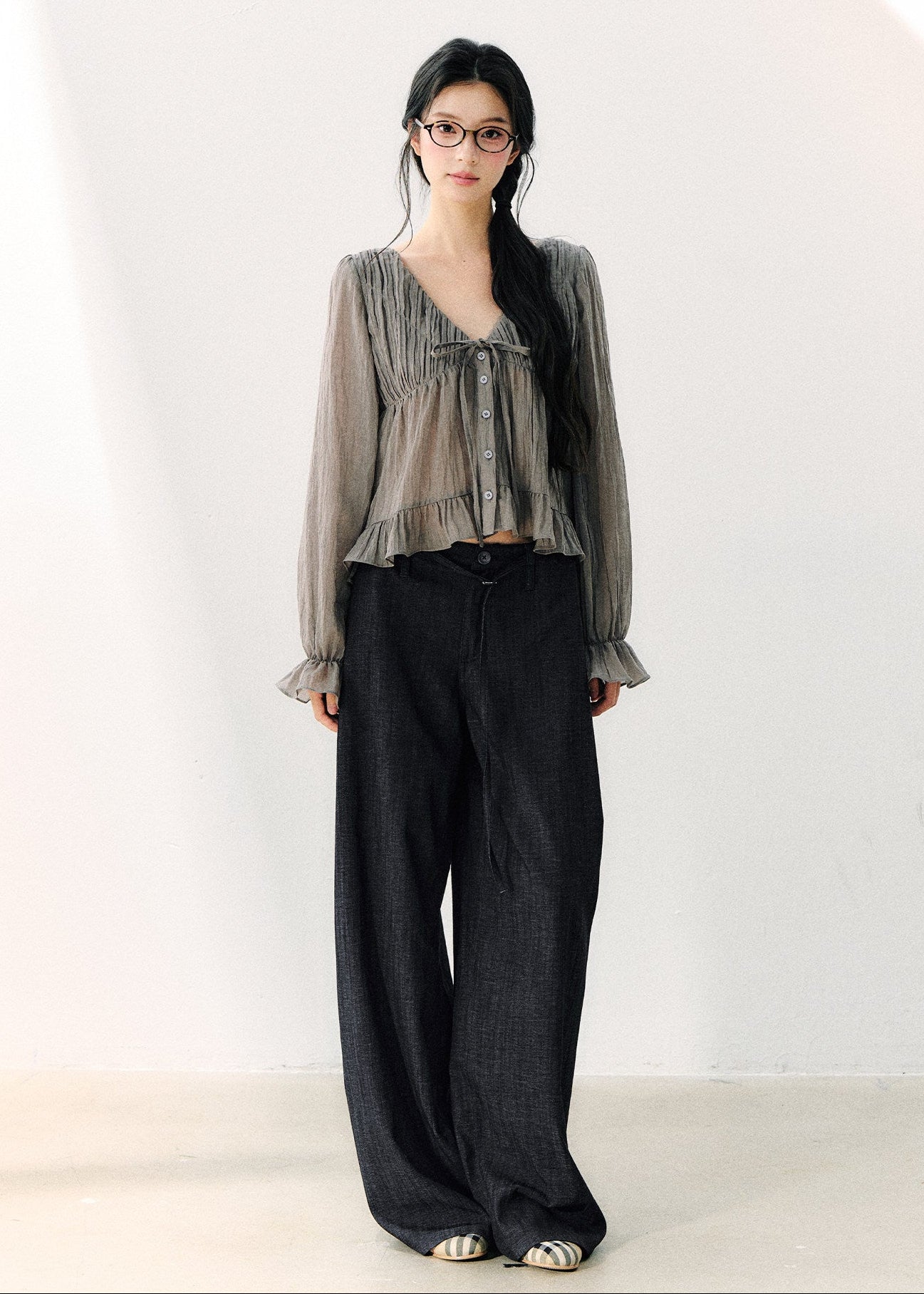 Smoky gray ruffled V-neck blouse with front ties