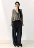 Smoky gray ruffled V-neck blouse with front ties