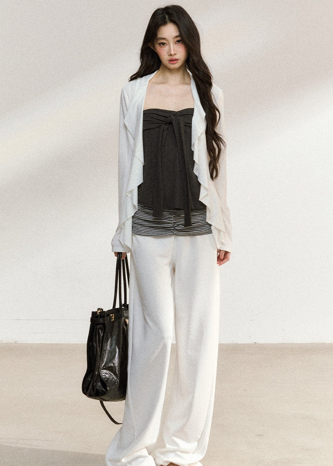 Women’s white cardigan and striped-hem camisole set
