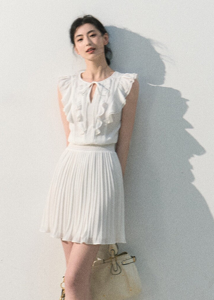 White ruffle pleated dress with a softly defined waist