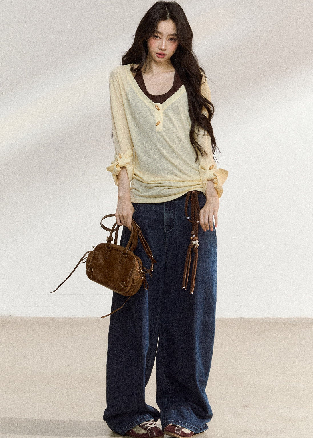 Pale yellow wooden-button cover-up with a brown camisole