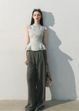 Light blue waist-cinching sleeveless blouse