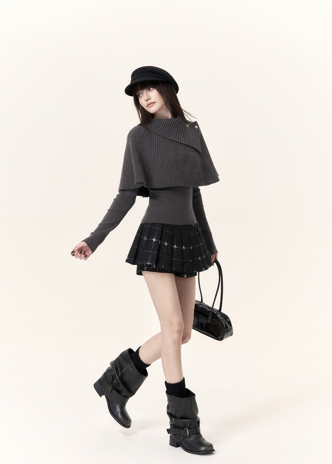 Women's black check-pattern mini skort with decorative button accents
