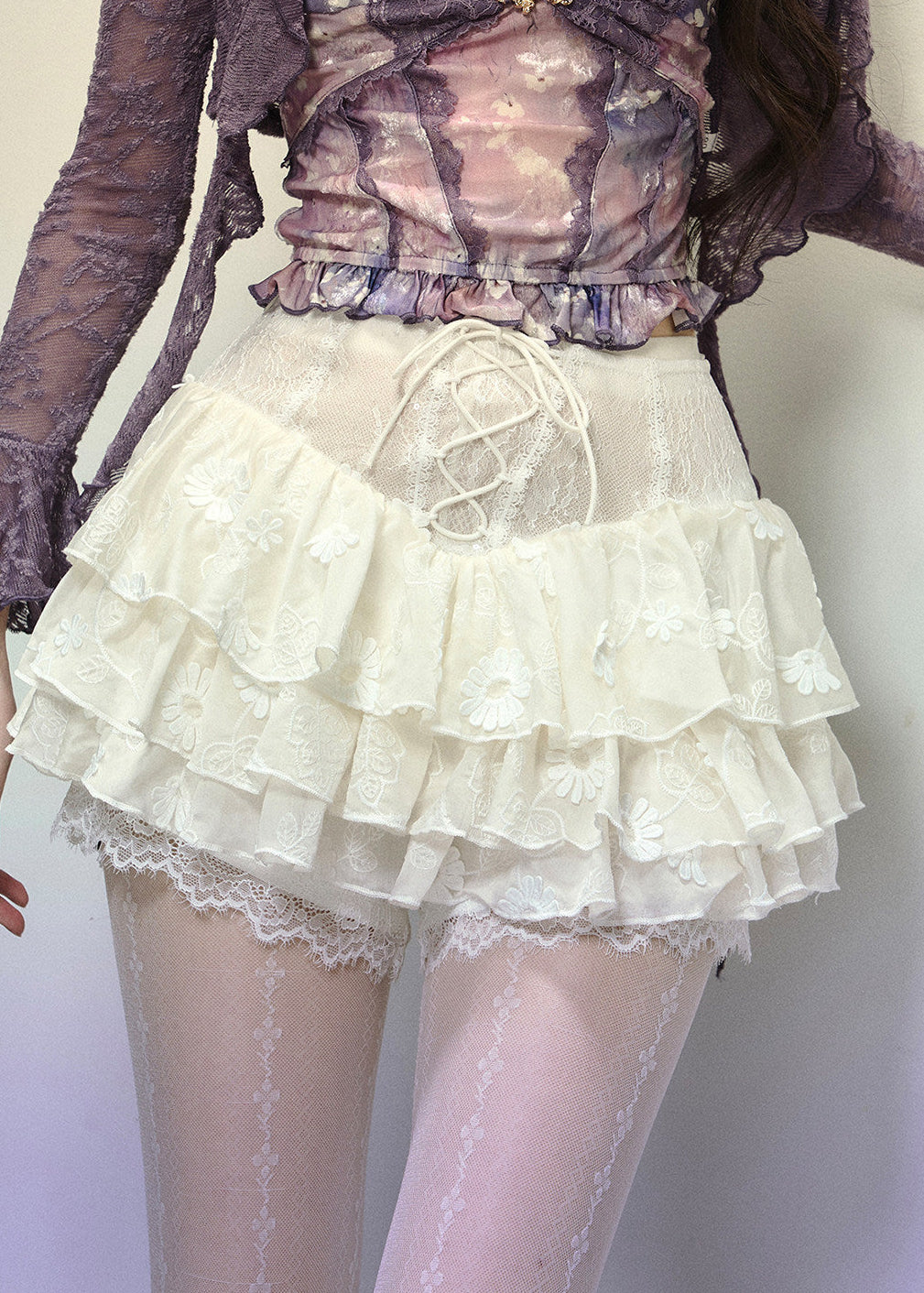 White layered lace mini skirt with ruffle hem