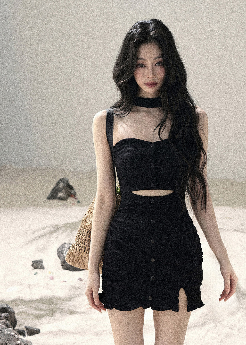 Black halter cutout knit mini dress with fitted silhouette and front button details