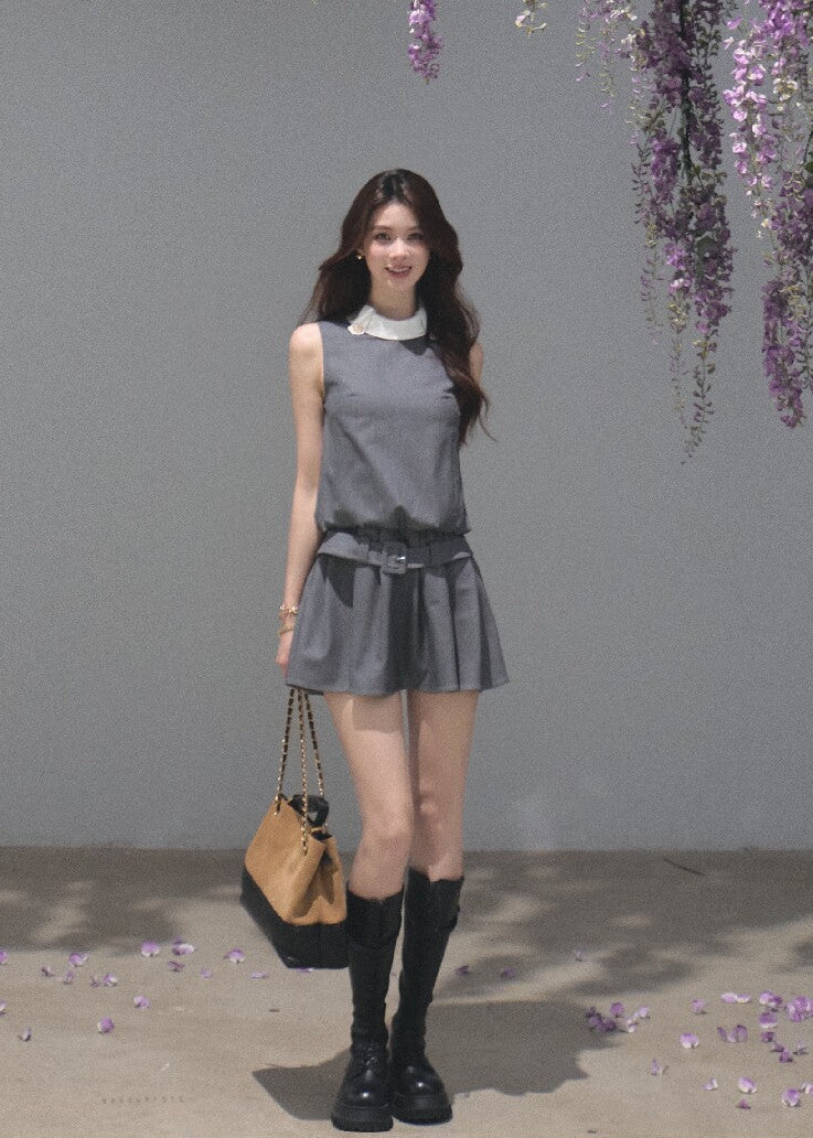 Sleeveless commuter-style dress with a white collar and gold-tone buttons