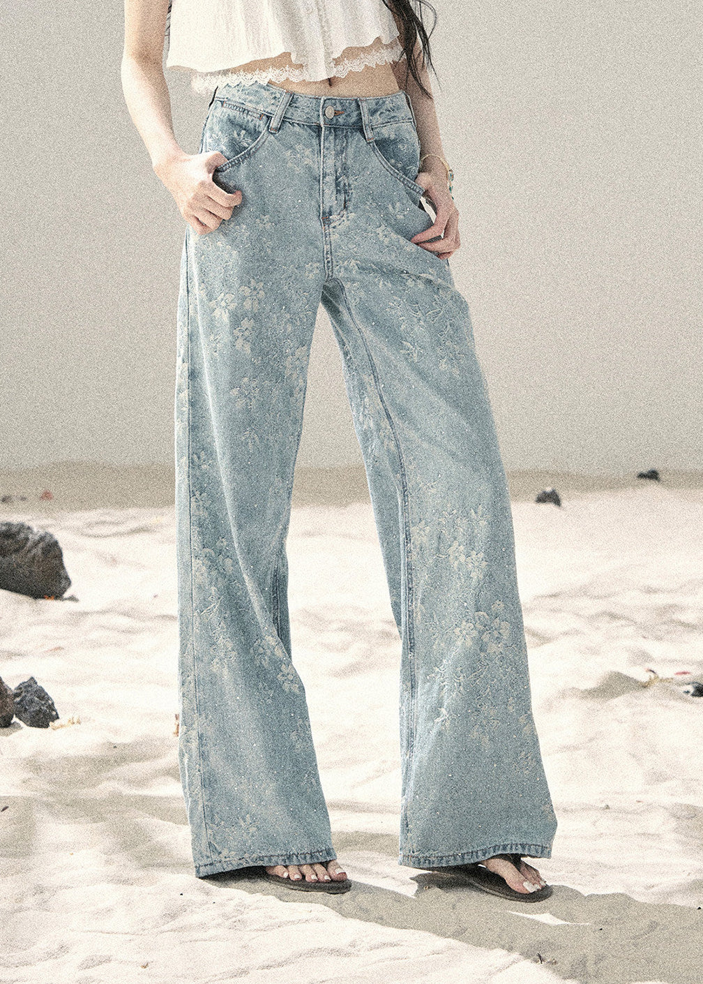 Light blue floral wide-leg jeans with sparkling embellishments