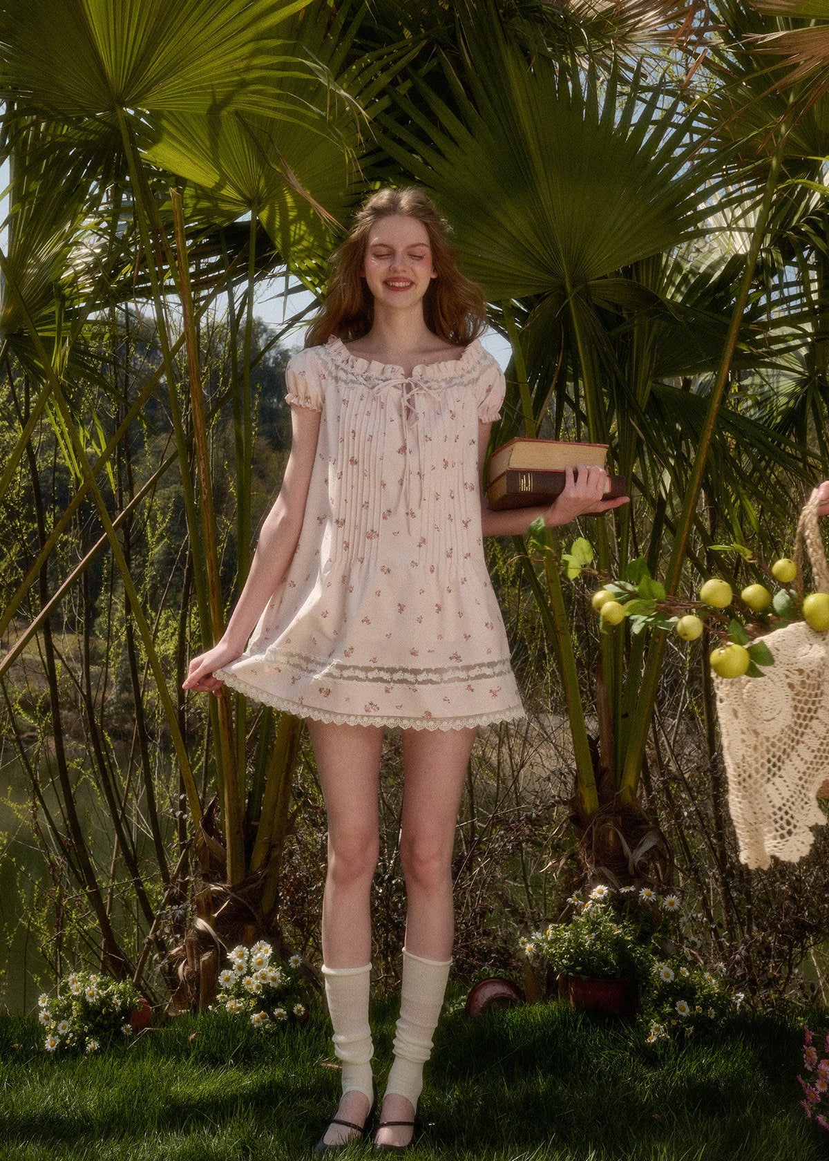 Feminine baby pink dress styled outdoors