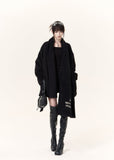 Women's black short coat with oversized draped scarf and buckle belt