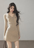 Women's fitted V-neck button cardigan with matching pleated knit skirt